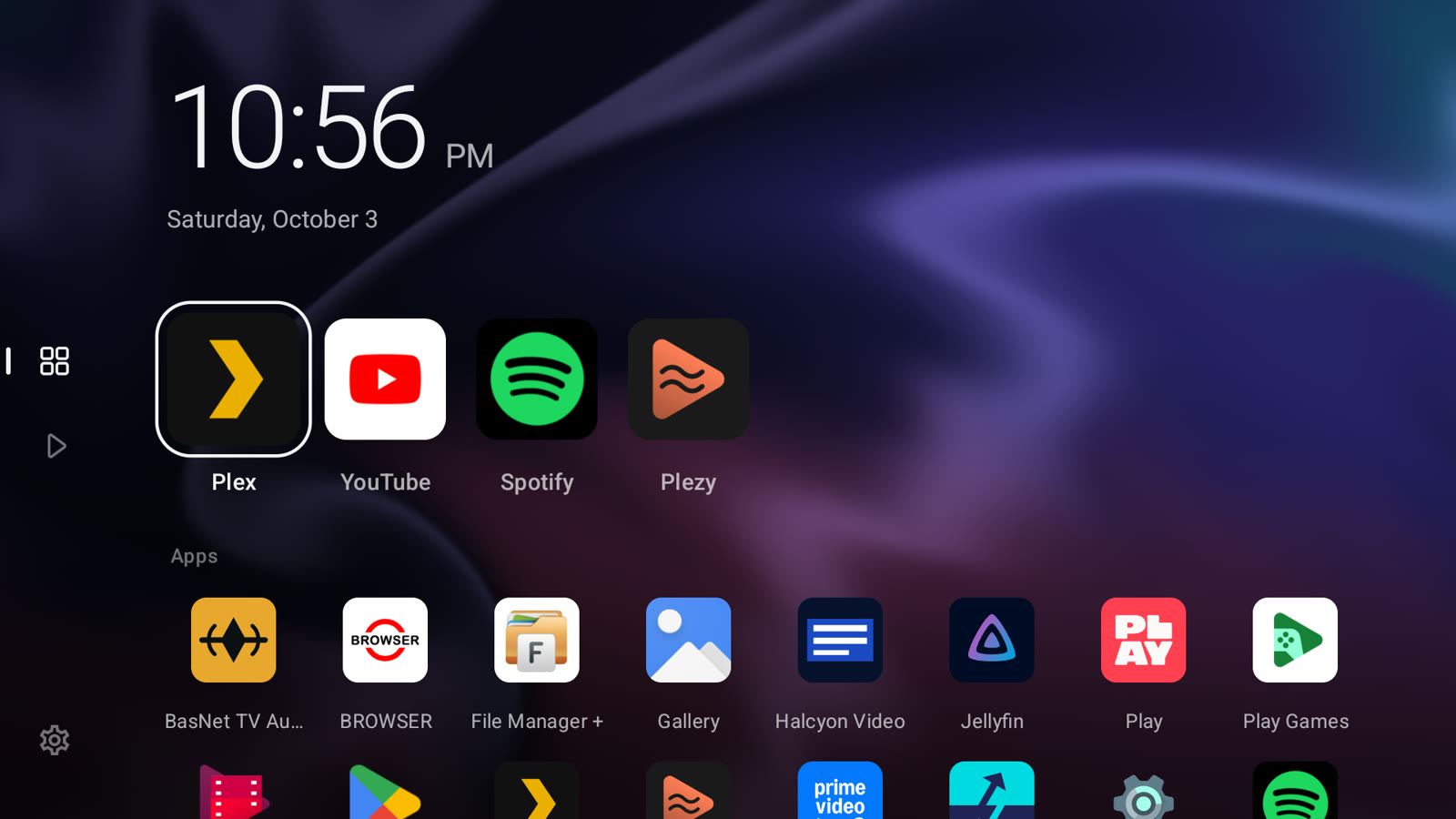 Quiet Home: a large clock, a row of favourite apps and the apps grid over a live background
